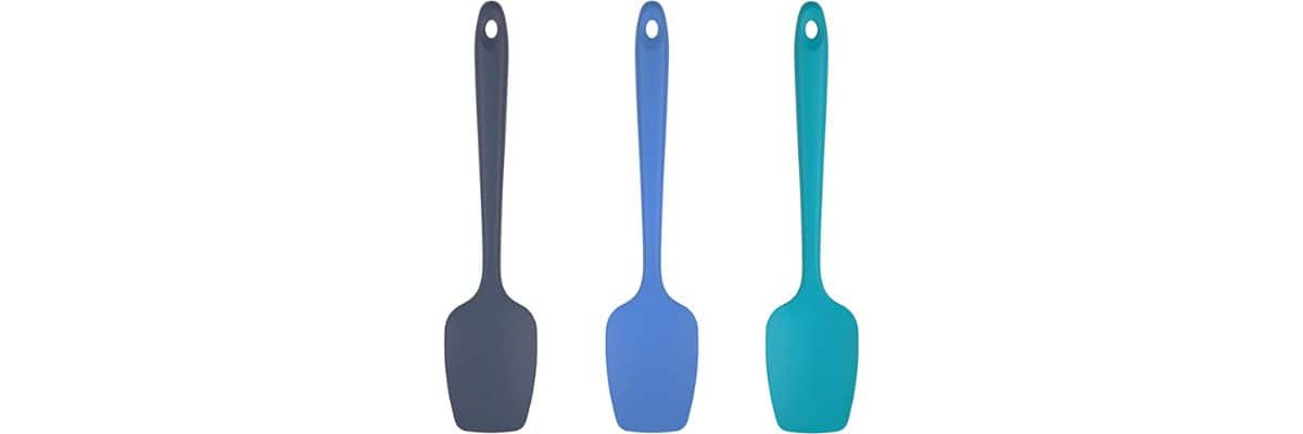 A row of three blue silicone spoons on a white background.