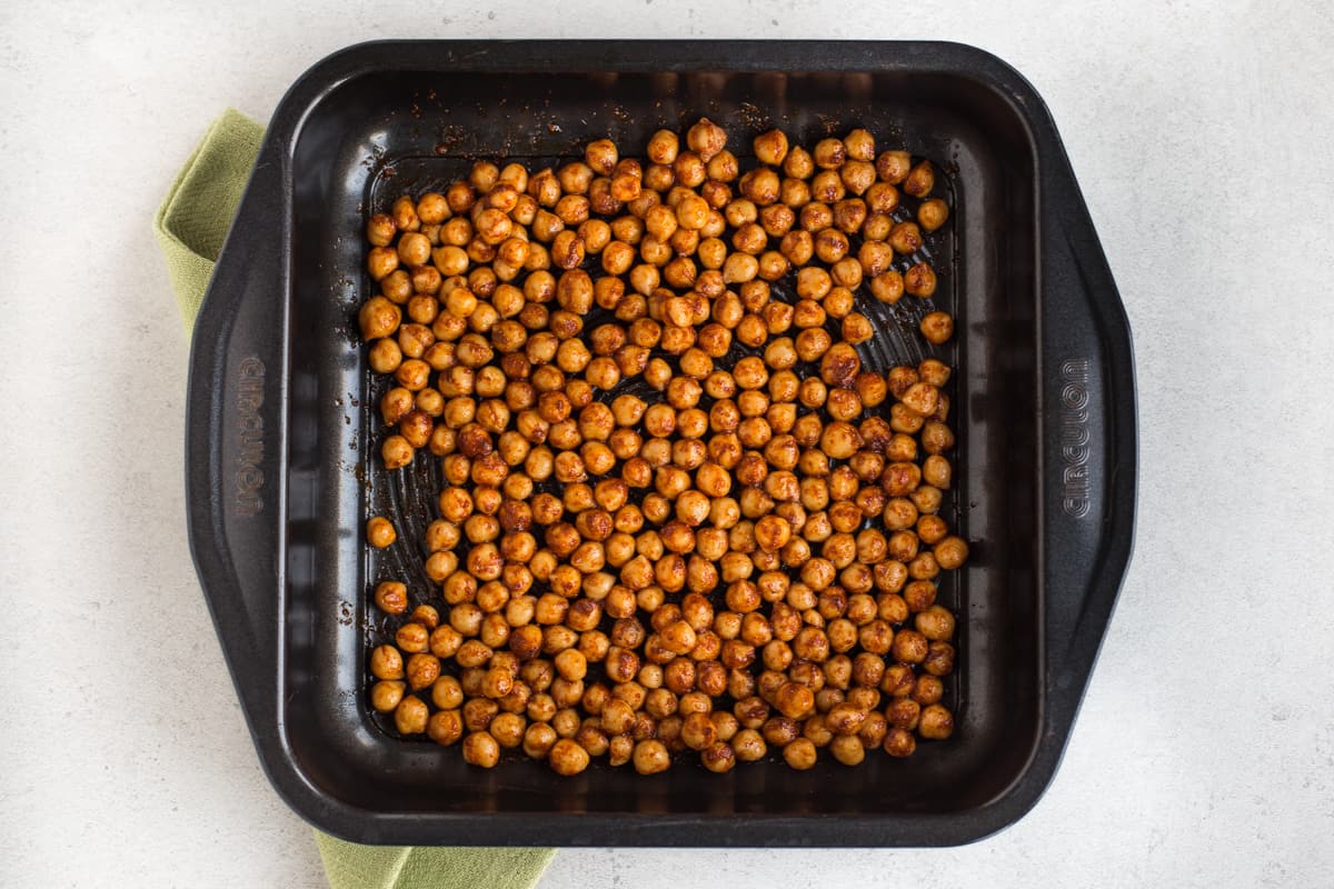 Spicy roasted chickpeas in a baking tray.