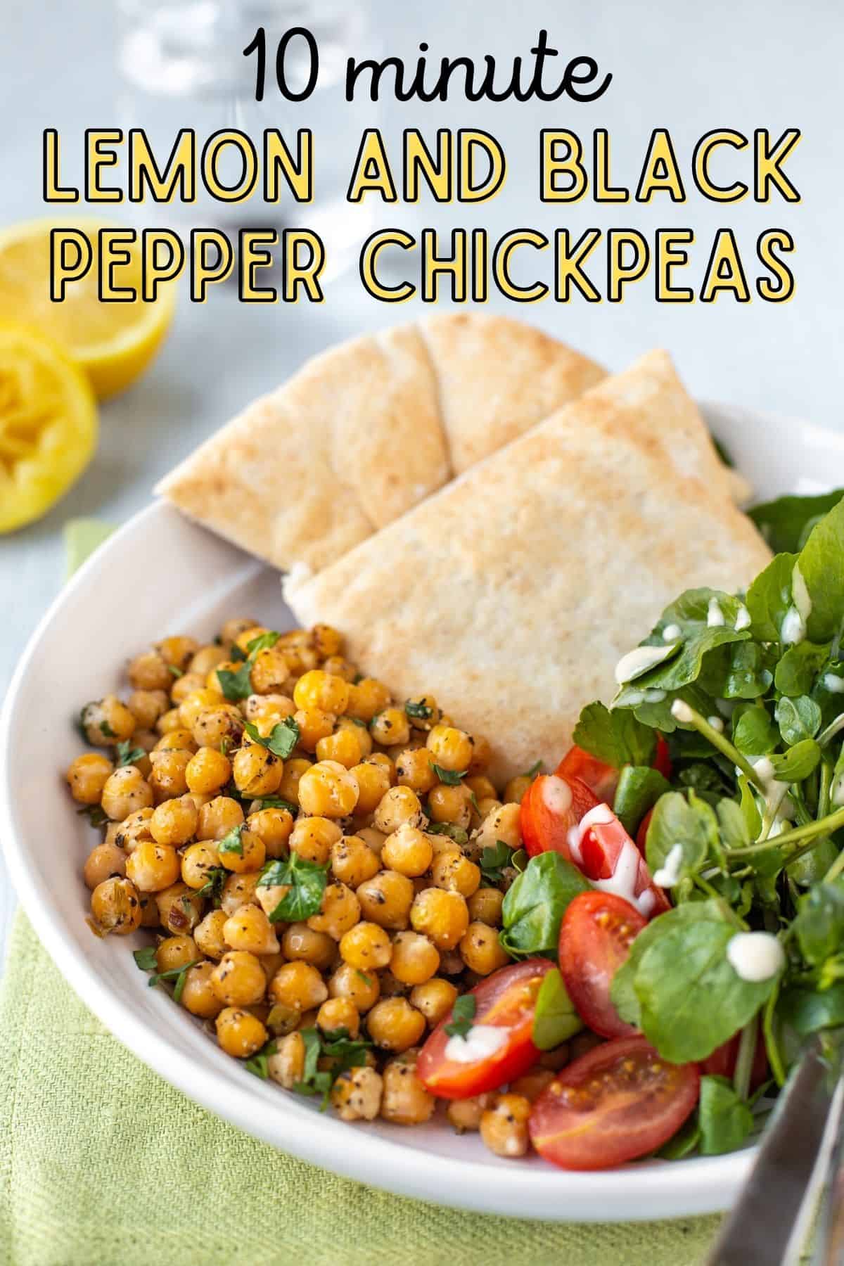 A portion of lemon and black pepper chickpeas in a bowl with salad leaves and pitta bread.
