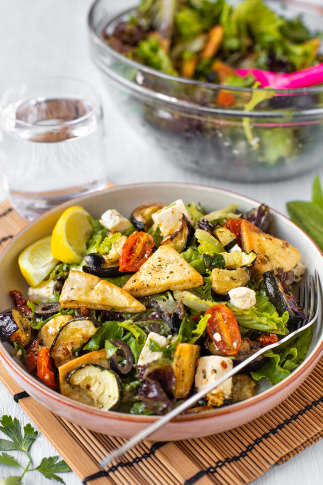 Roasted vegetable fattoush in a bowl.