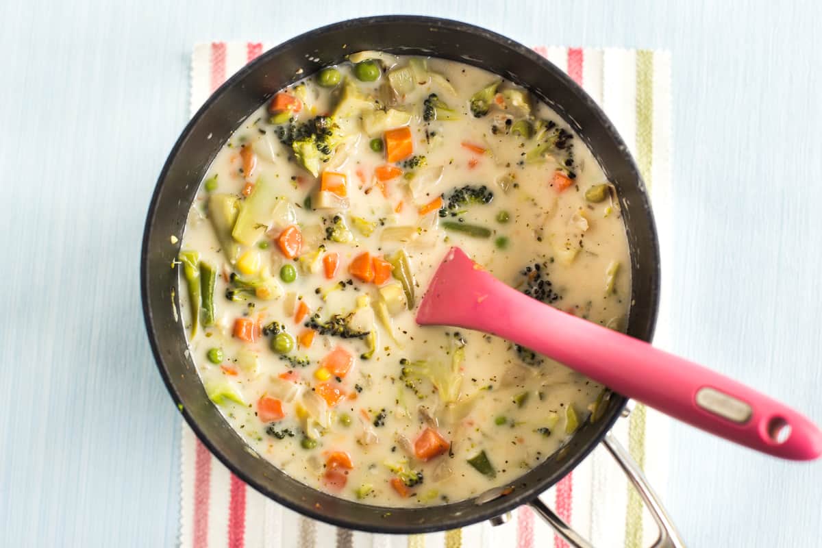 Creamy veggie pot pie soup in a pan