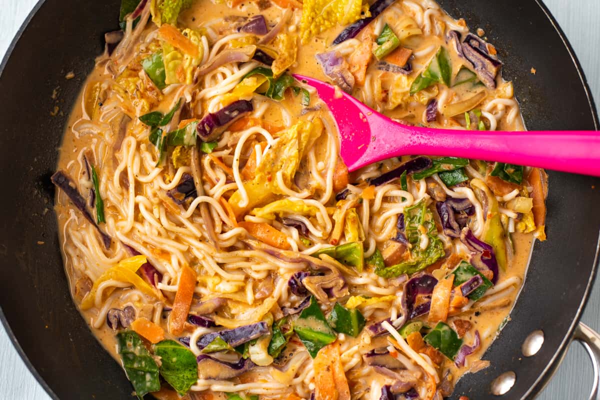 Thai curry noodle soup in a wok.