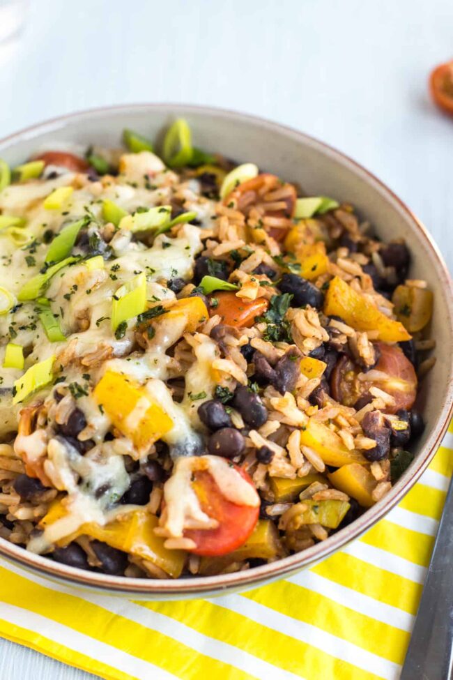 Vegetarian burrito bowl with black beans, rice and vegetables.