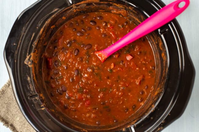 Black bean soup in a slow cooker.