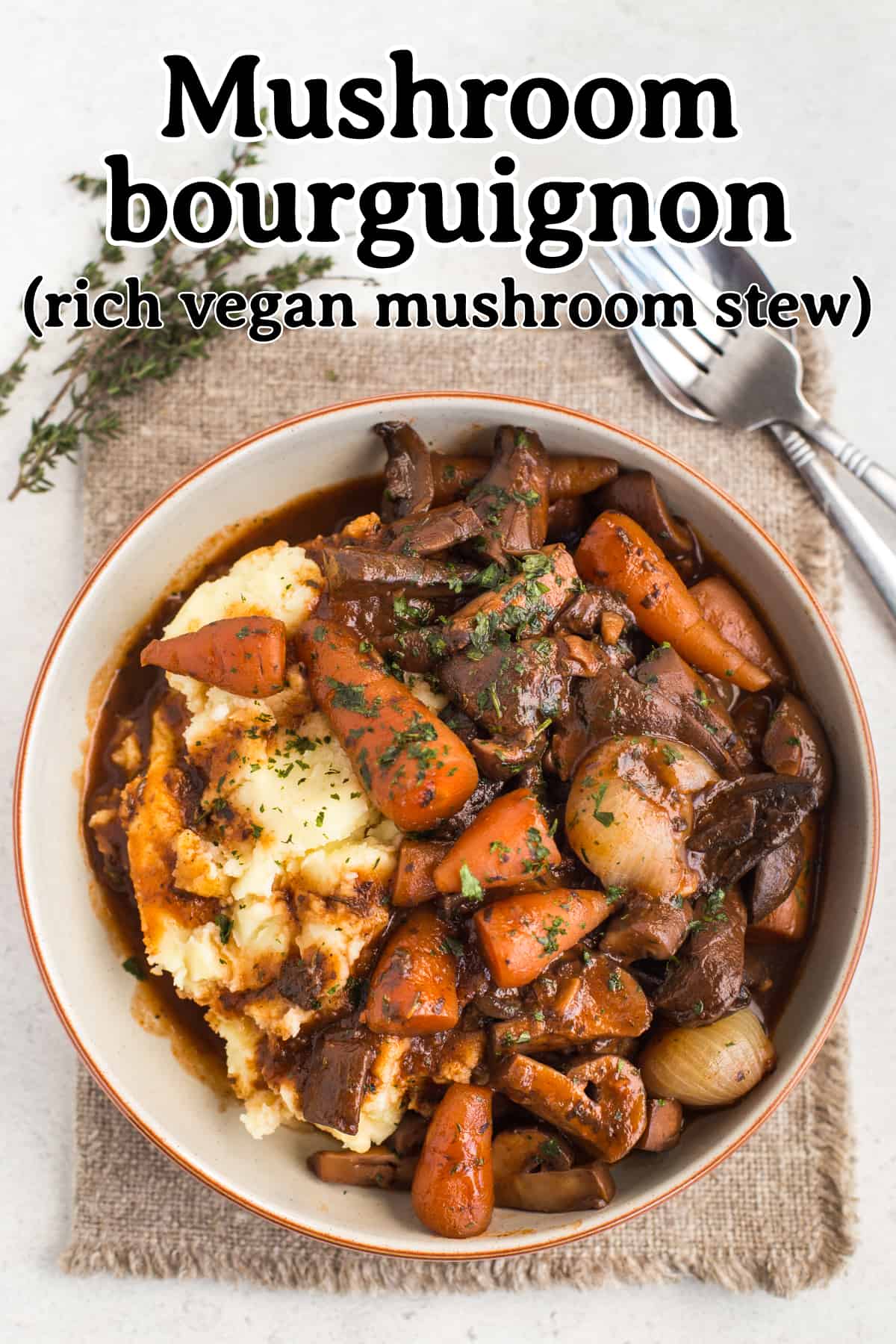 Portion of vegan mushroom bourguignon in a bowl with mashed potatoes.