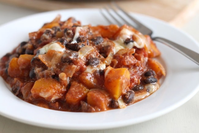 Butternut squash and black bean skillet - a hearty, autumnal one-pot meal with squash, beans, and loads of gooey cheese!