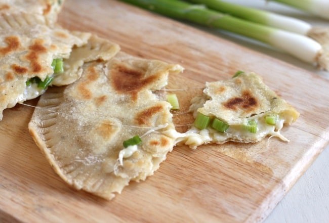 Cheese and onion stuffed flatbreads - oozing with cheese and spring onions, these stuffed flatbreads are really easy to make!