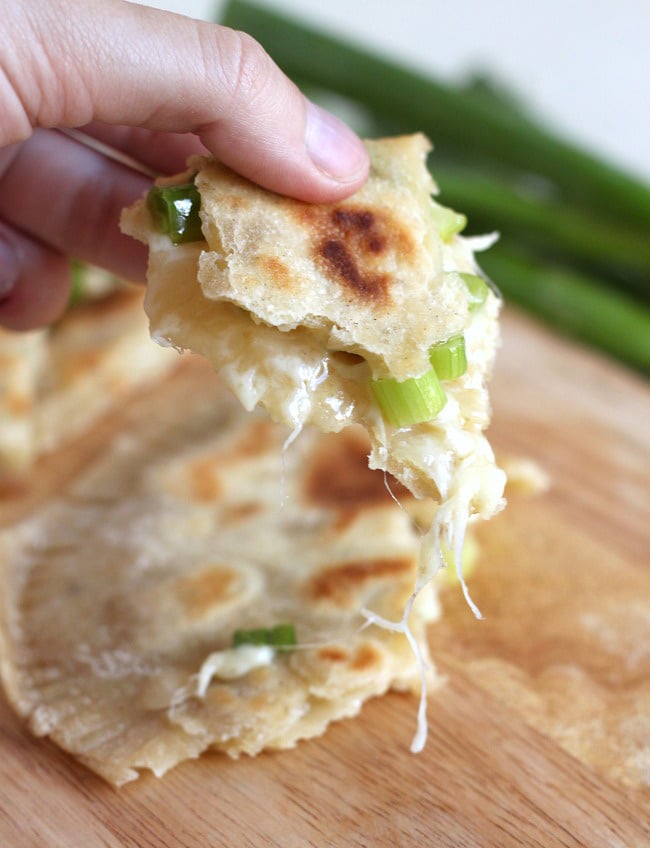 Cheese and onion stuffed flatbreads - oozing with cheese and spring onions, these stuffed flatbreads are really easy to make!