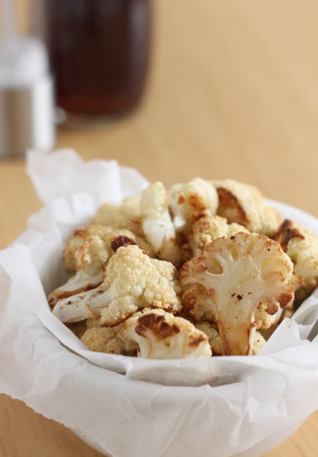 Salt and vinegar roasted cauliflower - a super healthy, low carb snack that's just as tasty as greasy salt and vinegar crisps!