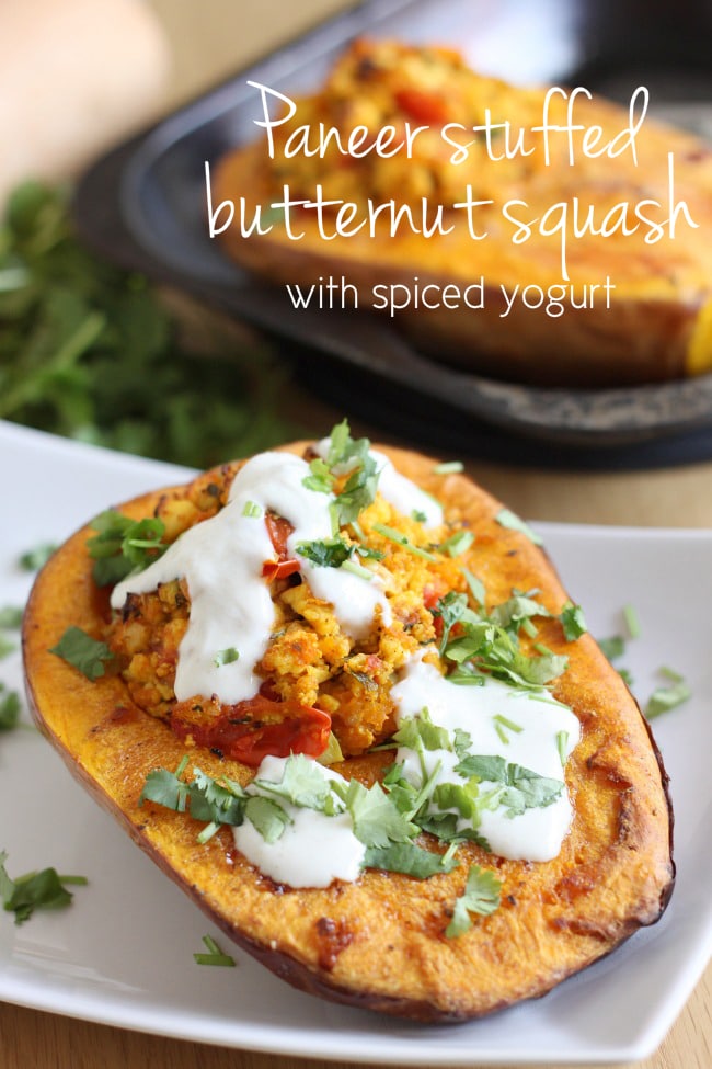 Paneer stuffed butternut squash with spiced yogurt - a great vegetarian option for an alternative Thanksgiving!