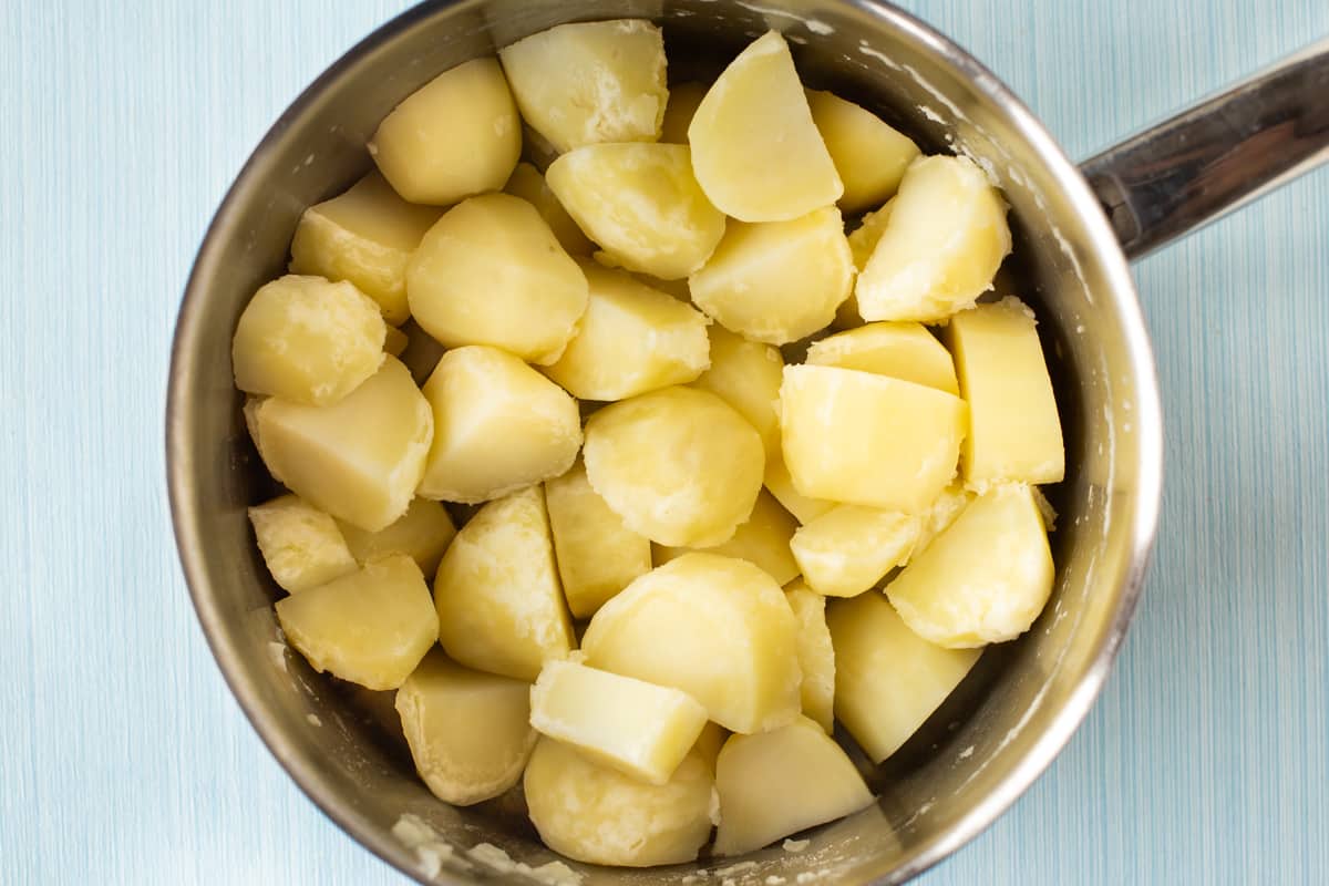 Boiled potatoes in a large saucepan.