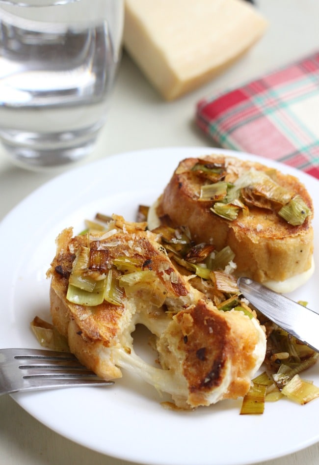 Leek and cheese stuffed savoury French toast - filled with gooey mozzarella, with a crispy parmesan coating, this French toast is great for a lazy weekend brunch!