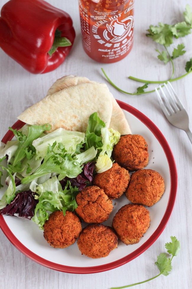 Roasted red pepper falafel with sriracha - sweet and spicy, and perfect in pitta bread with salad and a drizzle of sauce!