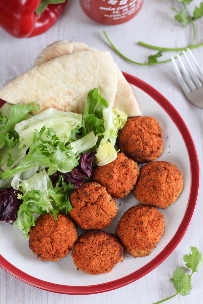Roasted red pepper falafel with sriracha - sweet and spicy, and perfect in pitta bread with salad and a drizzle of sauce!