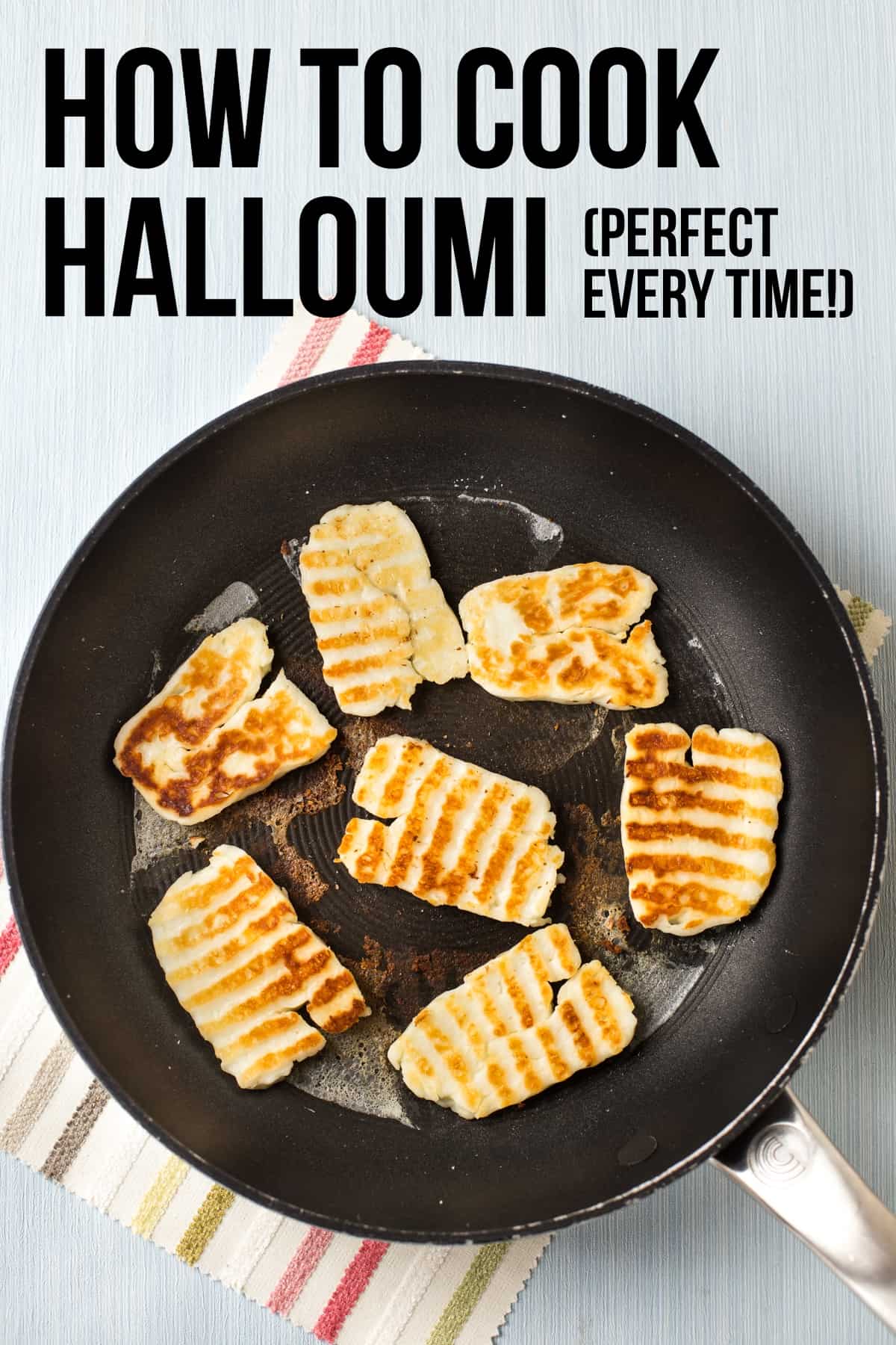 Slices of fried halloumi in a frying pan.