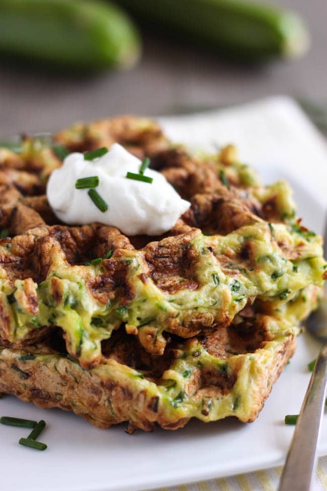 Courgette fritter waffles - a cross between a crispy zucchini fritter and a cakey waffle. So fun and delicious too!