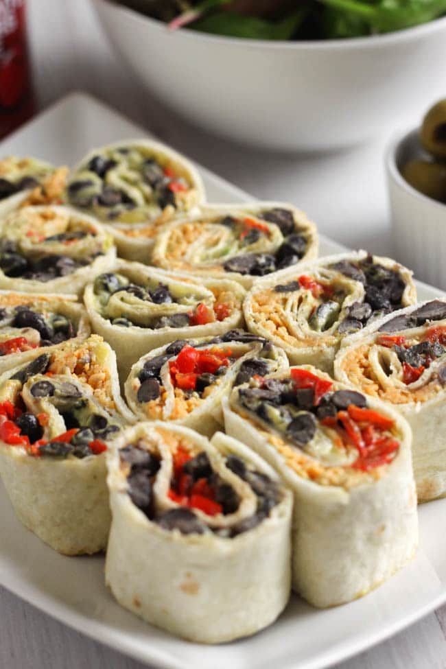 Cheesy Tex Mex tortilla roll-ups - THESE ARE MY NEW FAVOURITE LUNCH EVER! They're creamy, cheesy, spicy, and just SO tasty. Great for a packed lunch, or to serve on a platter at a party! Definitely one I will revisit again and again :)