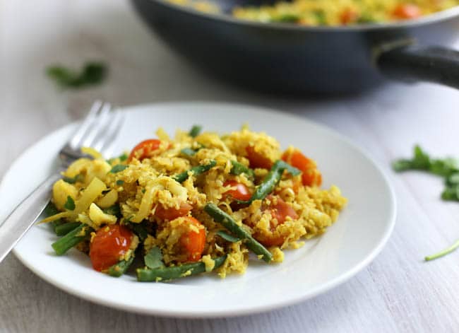 Low-carb tikka cauliflower rice - only 200 calories for a generous portion! Serve it as a side dish alongside your favourite curry, or throw in some protein to make it a full meal. Vegetarian, vegan and gluten-free!