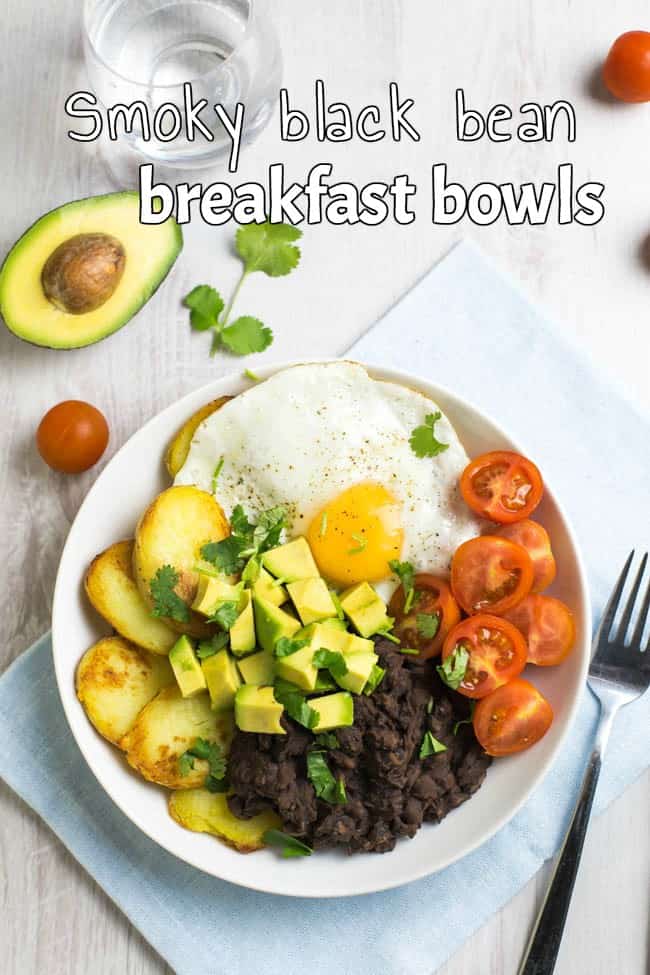 Smoky black bean breakfast bowls! Spicy chipotle black beans, served with crispy potatoes, a fried egg, and lots of fresh veggies - a brilliant way to start the day! Vegetarian, gluten-free, and easily made vegan.