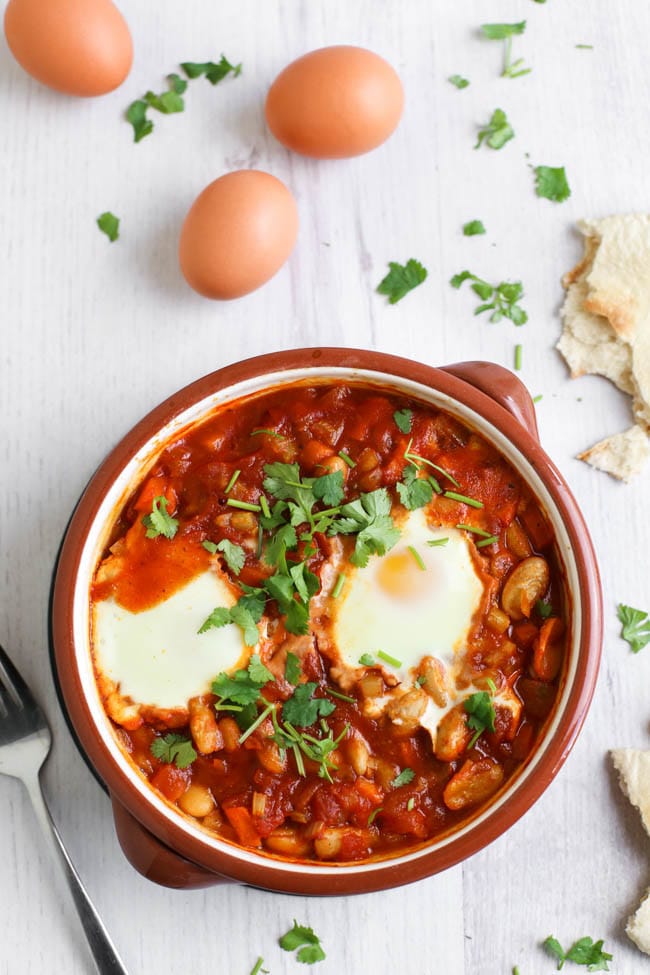 Cannellini bean shakshuka (eggs baked in a rich tomato sauce) - a hearty, high protein breakfast or lunch. It's vegetarian, really easy to make an totally delicious!