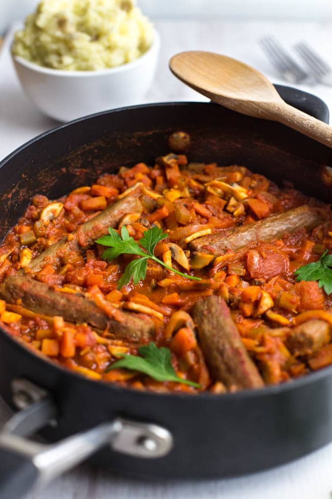 Vegetarian sausage casserole - a rich, tomatoey stew with vegan sausages and heaps of veggies. Comfort food made healthy!