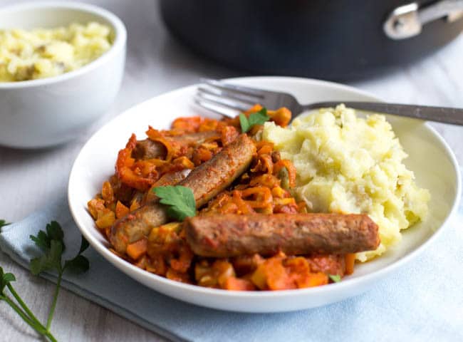 Vegetarian sausage casserole - a rich, tomatoey stew with vegan sausages and heaps of veggies. Comfort food made healthy!