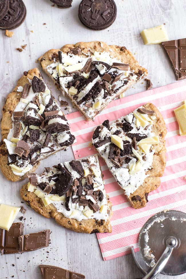 Cookies and cream dessert pizza - this would be such a great alternative to a birthday cake! A huge chocolate cookie, covered with marshmallow fluff and topped with Oreos and chocolate. It's easy to make but a real showstopper!