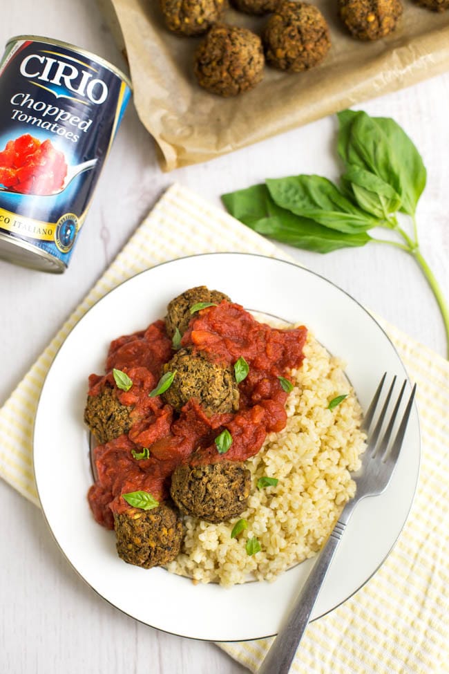 Mediterranean lentil meatballs with a rich tomato sauce - completely vegan! The best vegetarian meatballs I've ever made, flavoured with olives and fresh basil, and perfect served with spaghetti or your favourite grain.