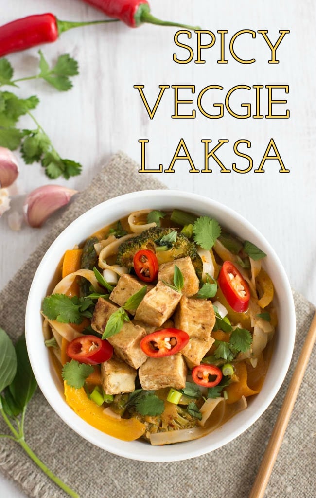A bowl of vegetarian laksa topped with crispy tofu cubes.