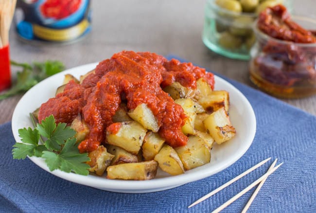 Vegan patatas bravas with tomato sauce.