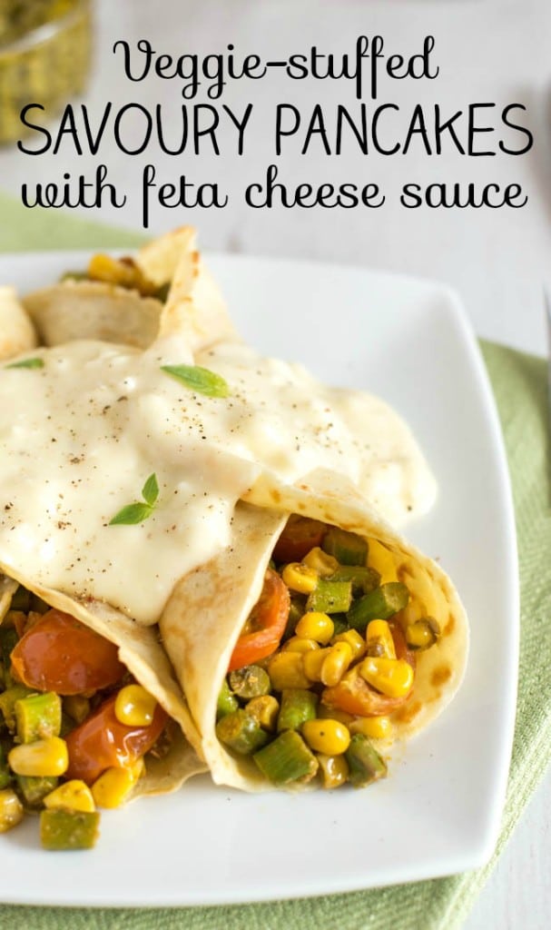 Savoury pancakes rolled around a vegetable filling, topped with feta cheese sauce.