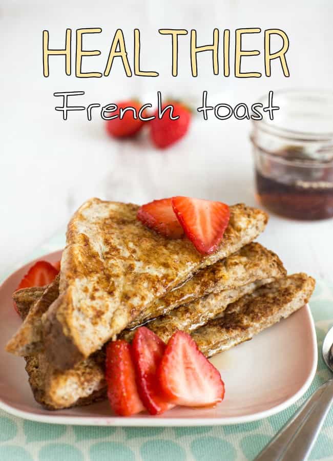 A stack of healthier wholewheat French toast with syrup and fresh strawberries.
