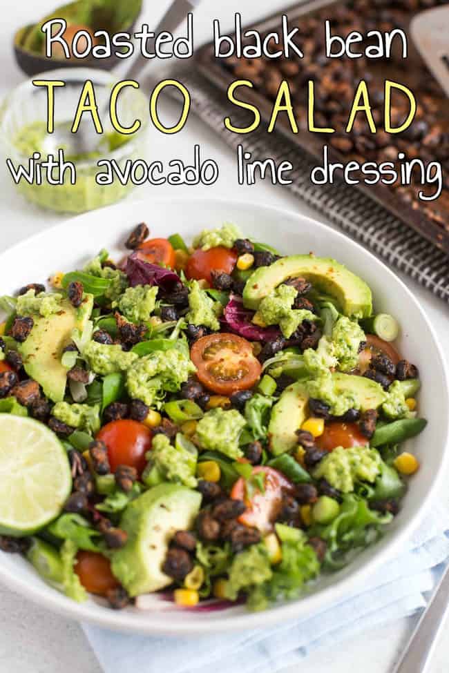 A vegan taco salad topped with roasted black beans and avocado.