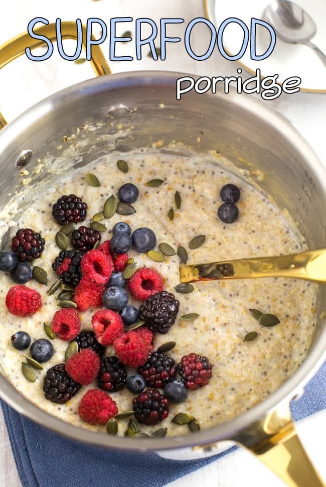Superfood porridge with quinoa, flax and chia, as well as the usual oats. Topped with pumpkin seeds and berries for even more goodness! A super healthy vegetarian / vegan / gluten-free breakfast.