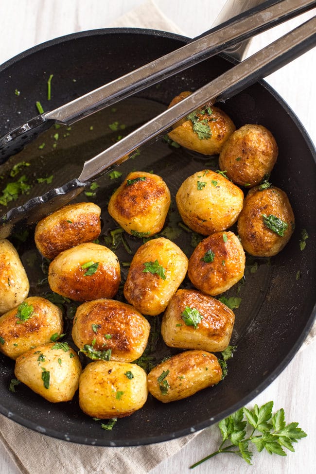Buttery chateau potatoes - cooked in garlicky butter, then roasted until they're nice and crispy. SO GOOD! The perfect potato side dish.
