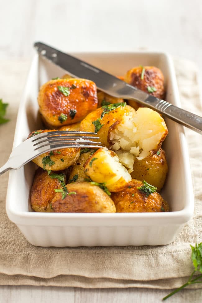 Buttery chateau potatoes - cooked in garlicky butter, then roasted until they're nice and crispy. SO GOOD! The perfect potato side dish.