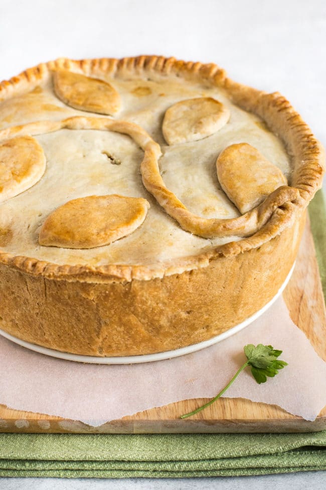 A shortcrust pastry pie with a leafy pattern on top