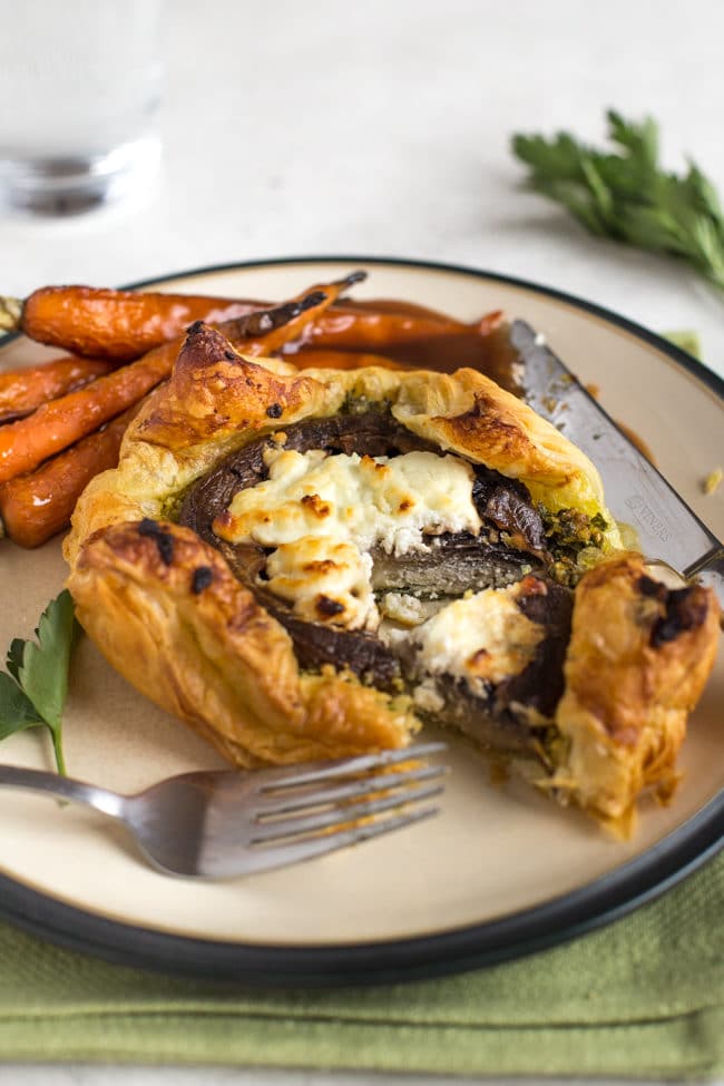 Easy mushroom and goat's cheese wellingtons with parsley pesto - a really easy version of a mushroom wellington! These individual pies are perfect for a vegetarian Christmas.
