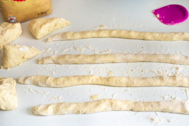 Long snakes of ricotta gnocchi dough.