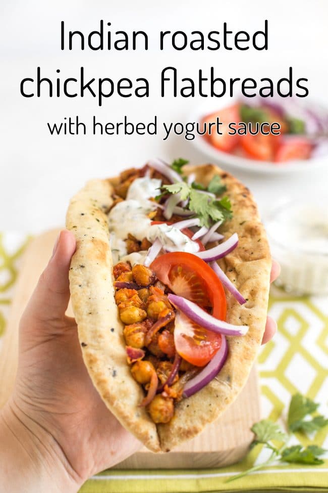 Indian roasted chickpea flatbread being held up in a hand