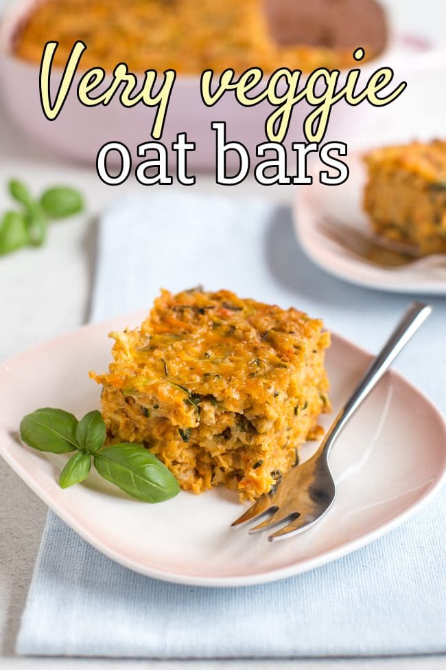 Very veggie oat bars on a plate with fresh basil and a fork