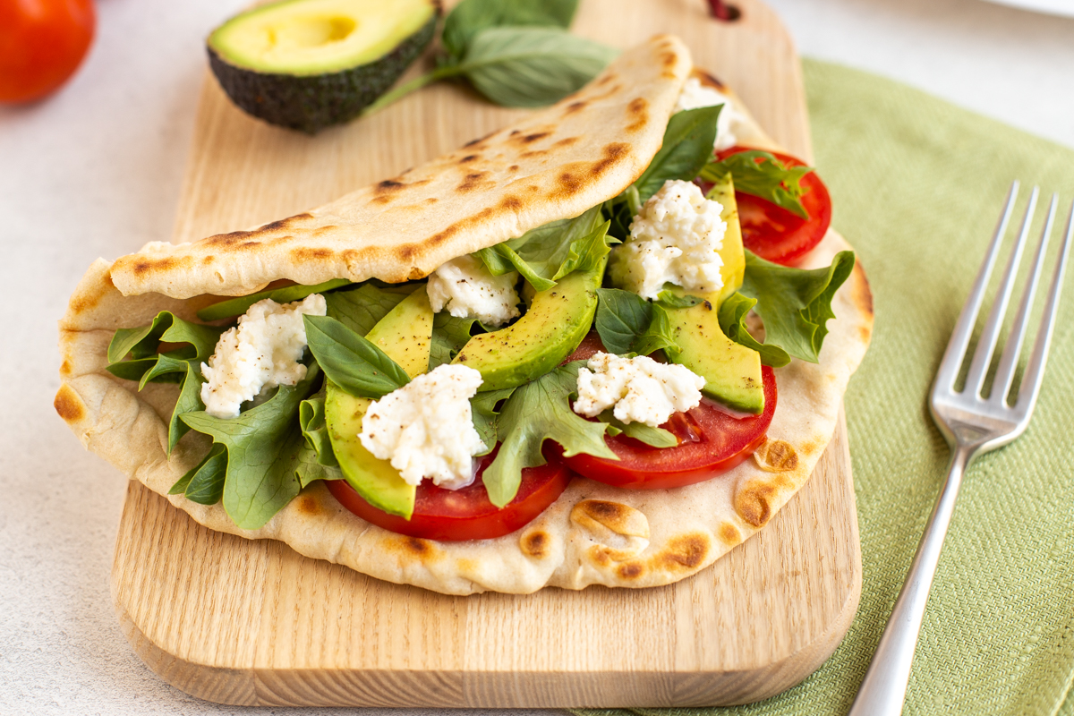 Easy homemade flatbreads stuffed with avocado and salad.