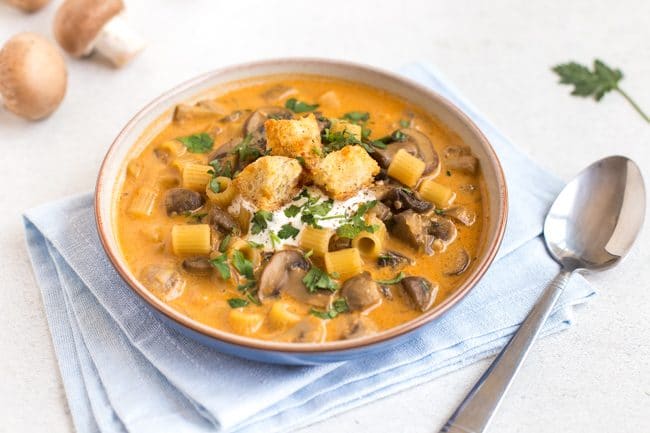 Bowlful of mushroom stroganoff soup with garlic croutons