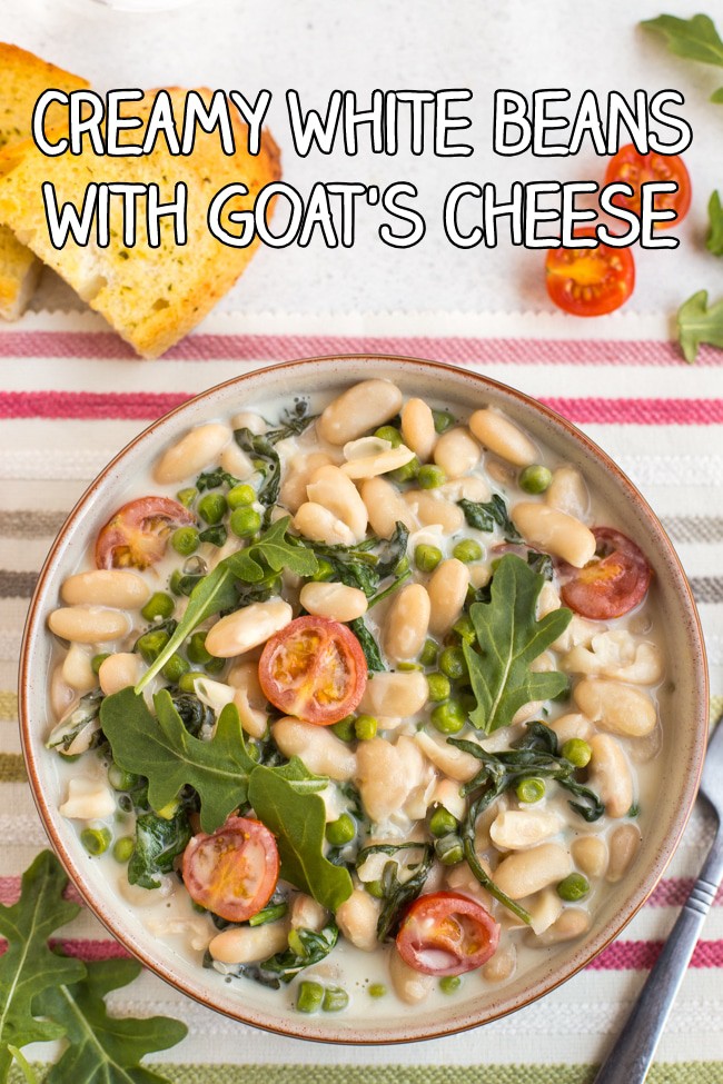 Creamy white beans with rocket and tomatoes in a bowl