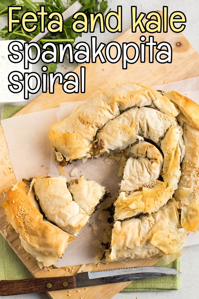 Spanakopita spiral on a chopping board with a slice removed