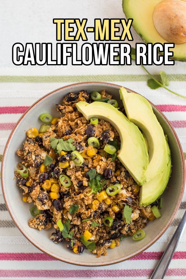 Portion of Tex-Mex cauliflower rice in a bowl with avocado slices
