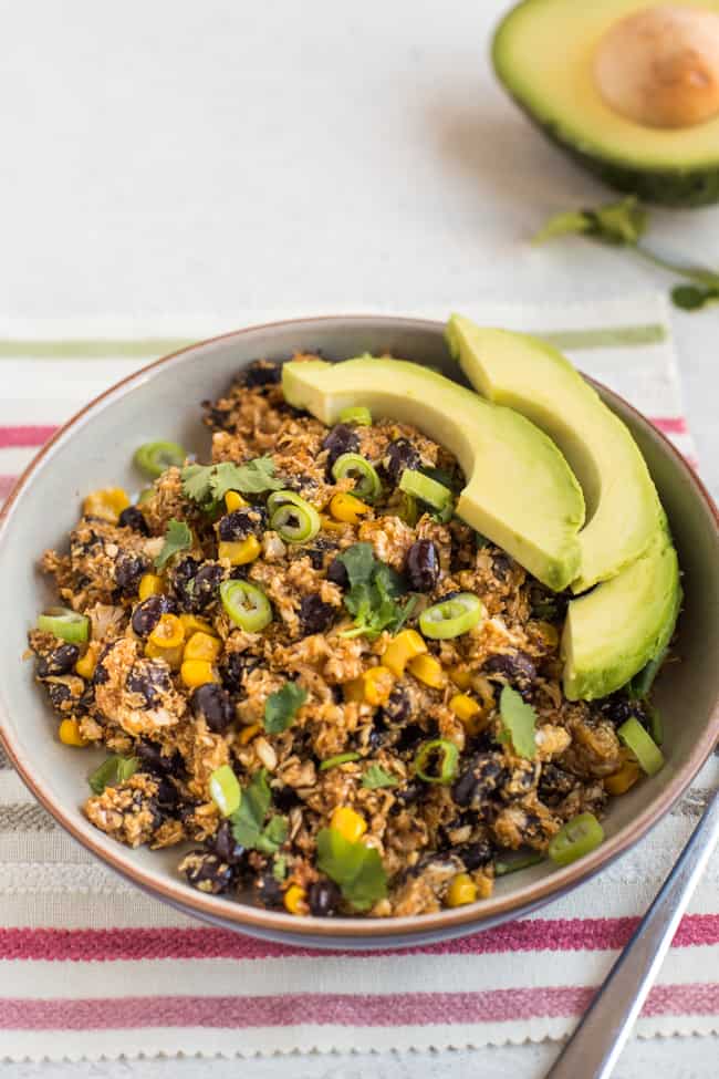 Tex-Mex cauliflower rice in a bowl with avocado