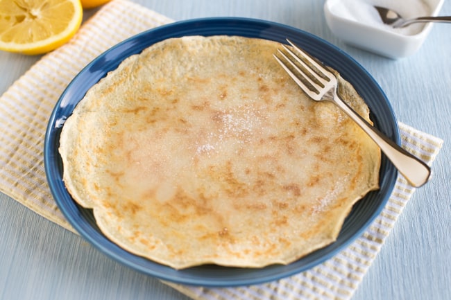 A traditional British pancake on a plate.
