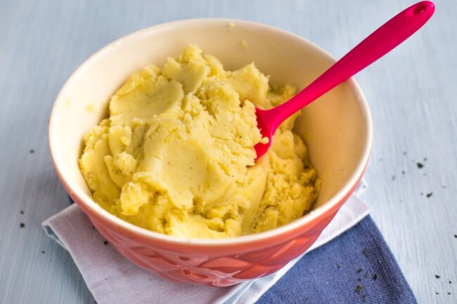 Cheesy mashed potato in a bowl.