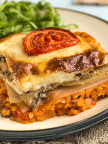 Portion of vegetarian moussaka on a plate.